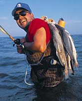 Wader Fisherman with fish stringer